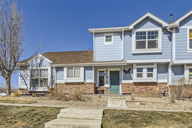 view of front of property featuring brick siding