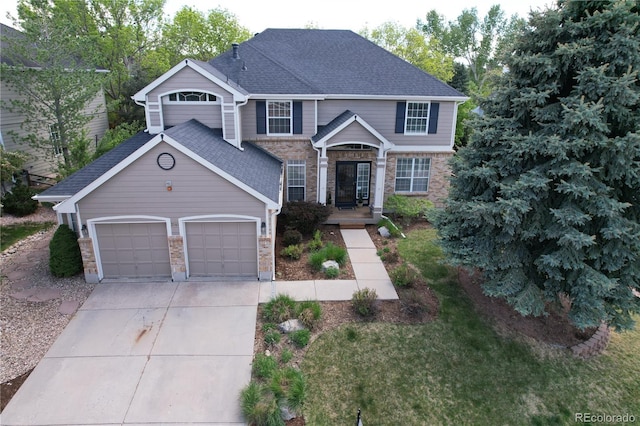 2141 Weatherstone Cir, Highlands Ranch, CO 80126 - traditional-style house with driveway, an attached garage, and stone siding