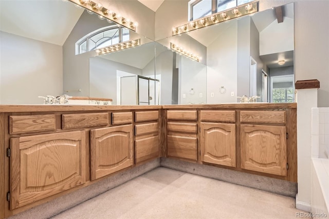 2141 Weatherstone Cir, Highlands Ranch, CO 80126 - full bathroom with high vaulted ceiling, double vanity, an enclosed shower, and a bathtub