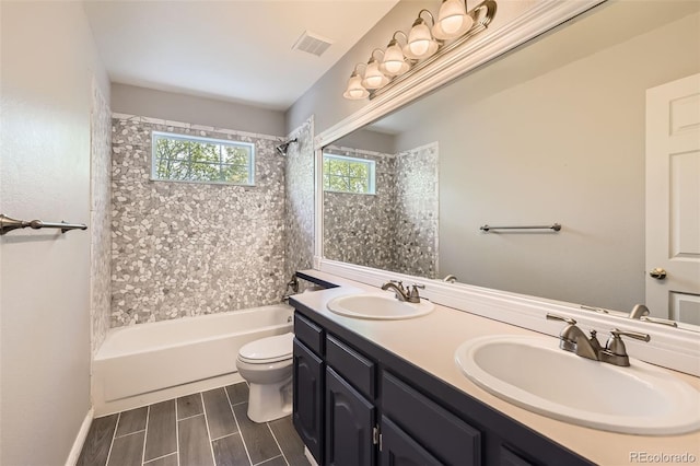 2141 Weatherstone Cir, Highlands Ranch, CO 80126 - full bathroom with toilet, bathtub / shower combination, double vanity, and wood tiled floors