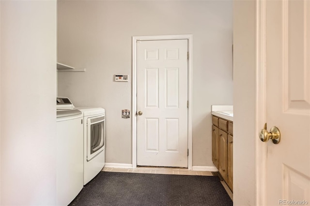 2141 Weatherstone Cir, Highlands Ranch, CO 80126 - laundry room with washer and dryer, dark colored carpet, and baseboards
