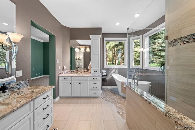 bathroom with vanity, backsplash, and plus walk in shower