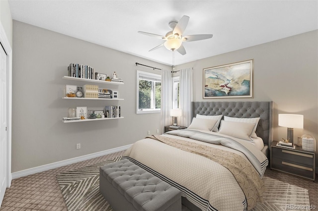 carpeted bedroom featuring ceiling fan