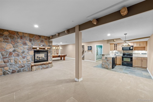 living room featuring billiards, light carpet, and a fireplace