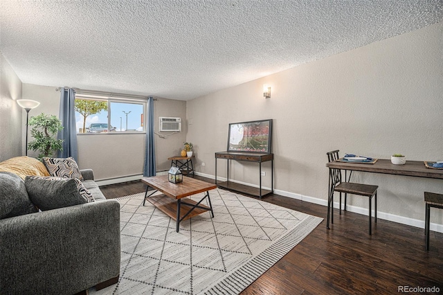 3047 W 47th Ave Unit 109, Denver, CO 80211 - living area with wood finished floors, a textured ceiling, a textured wall, a baseboard radiator, and a wall mounted air conditioner