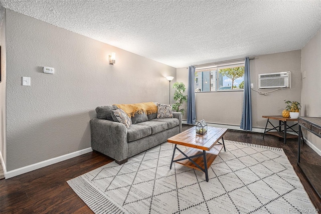 3047 W 47th Ave Unit 109, Denver, CO 80211 - living room featuring a textured wall, a textured ceiling, wood finished floors, a wall mounted air conditioner, and baseboard heating