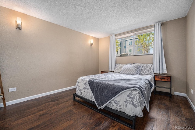 3047 W 47th Ave Unit 109, Denver, CO 80211 - bedroom with wood finished floors, a textured ceiling, and a textured wall