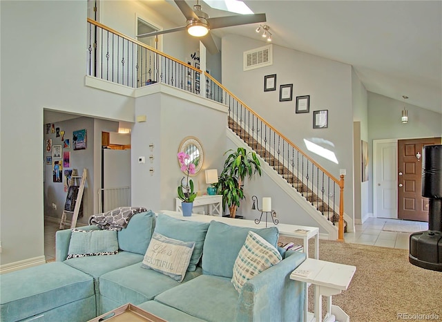 4506 Winewood Village Dr, Colorado Springs, CO 80917 - living area featuring high vaulted ceiling, stairs, a ceiling fan, baseboards, and tile patterned floors