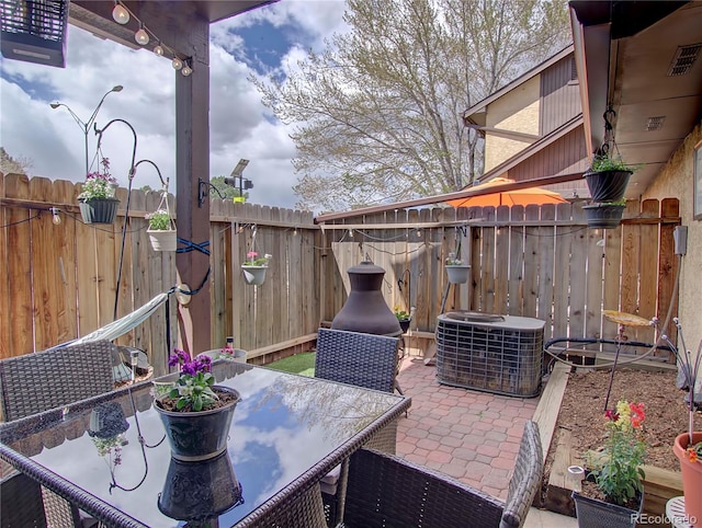 4506 Winewood Village Dr, Colorado Springs, CO 80917 - view of patio / terrace featuring central AC unit and outdoor dining area
