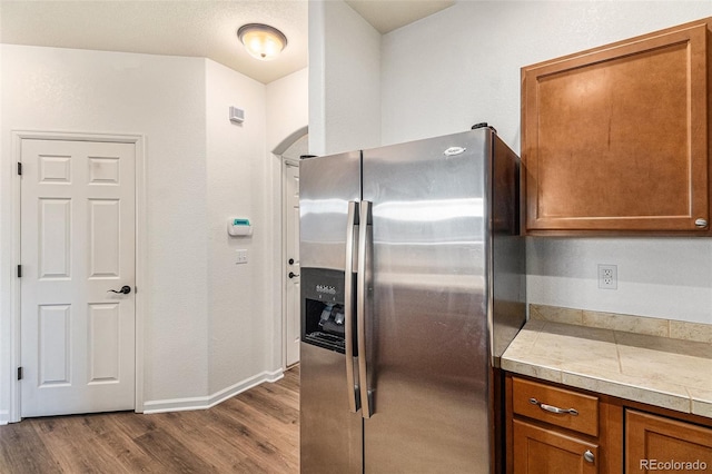 kitchen with stainless steel fridge and light wood-type flooring