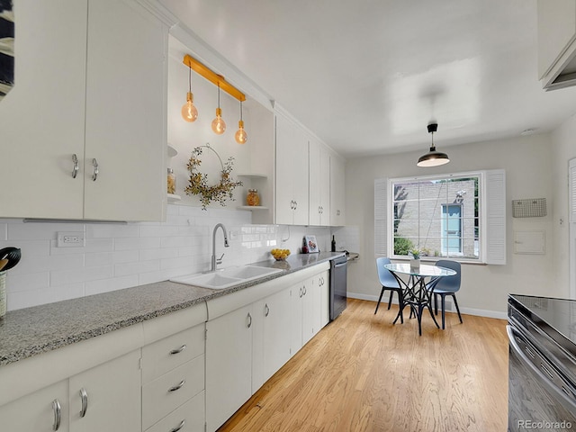 kitchen with open shelves, a sink, decorative light fixtures, and white cabinets