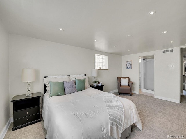 bedroom with light colored carpet, visible vents, baseboards, and recessed lighting