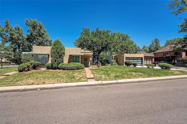 ranch-style house with a front lawn