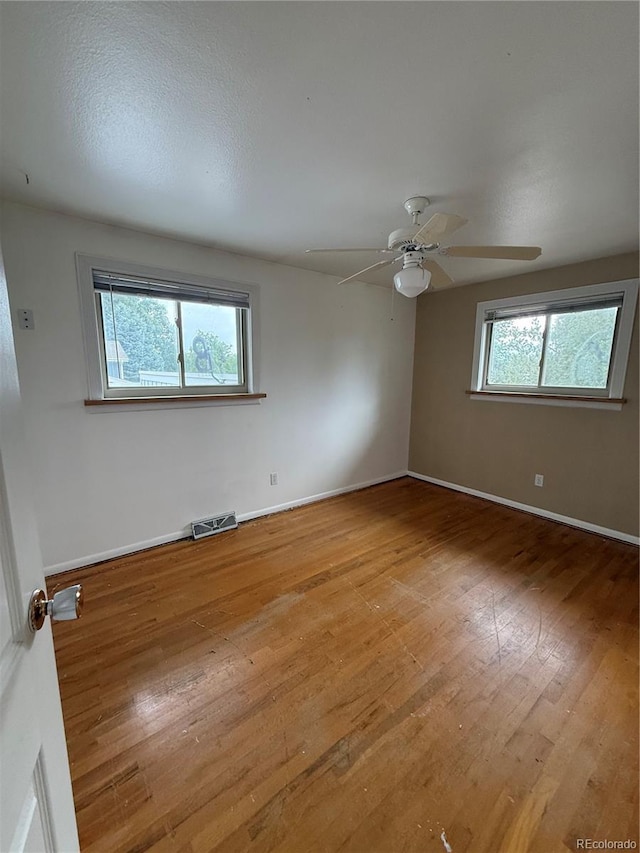 3566 E Fair Pl, Centennial, CO 80121 - empty room with light wood finished floors and a ceiling fan