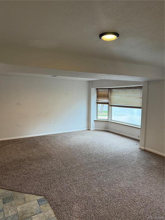 3566 E Fair Pl, Centennial, CO 80121 - spare room featuring light colored carpet and a textured ceiling