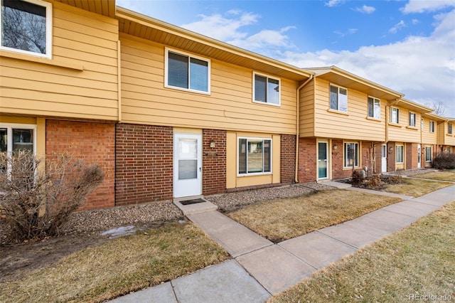 view of property with a front lawn