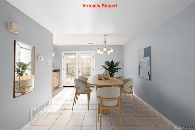 tiled dining room with french doors and a chandelier