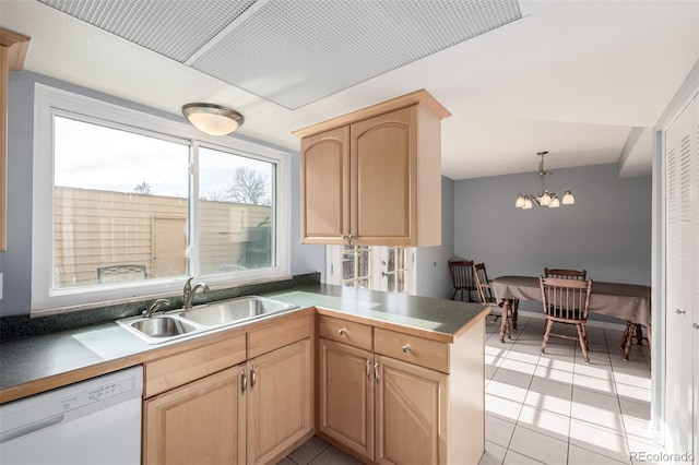 kitchen featuring pendant lighting, light brown cabinetry, dishwasher, sink, and kitchen peninsula