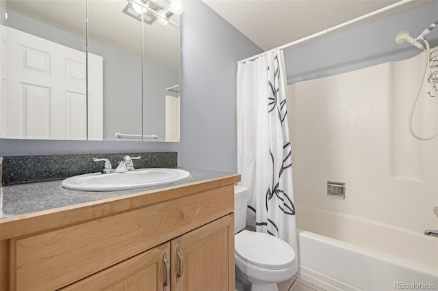 full bathroom with shower / tub combo with curtain, vanity, and toilet