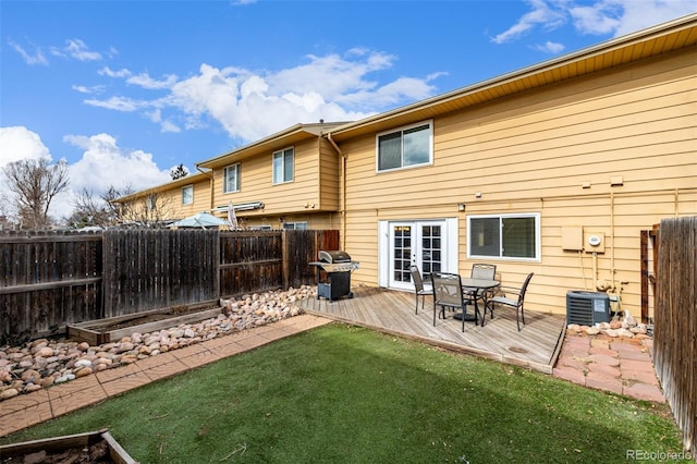 back of house with a wooden deck, a yard, central AC unit, and french doors