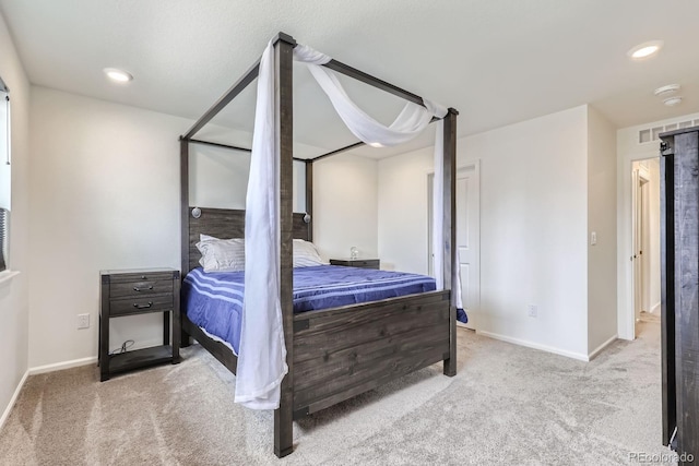 carpeted bedroom featuring baseboards, recessed lighting, and visible vents