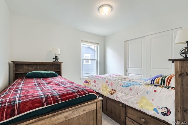 bedroom with carpet flooring and a closet