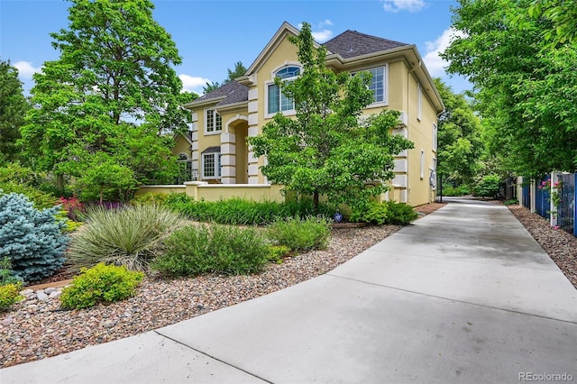 1564 S Uinta Way, Denver, CO 80231 - traditional-style home featuring stucco siding and driveway