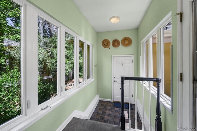1564 S Uinta Way, Denver, CO 80231 - sunroom featuring stone finish flooring and baseboards