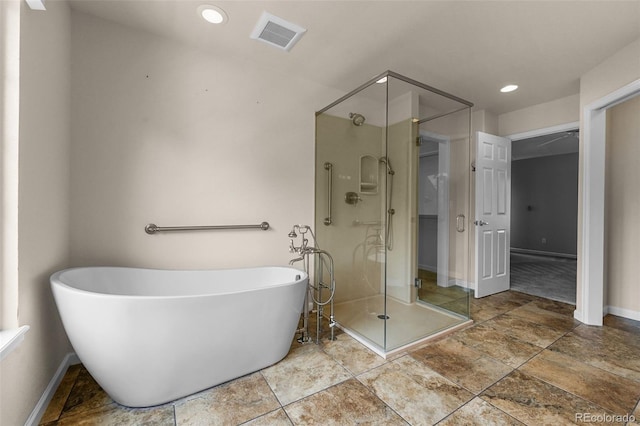 1564 S Uinta Way, Denver, CO 80231 - bathroom featuring a shower stall, baseboards, a soaking tub, and recessed lighting