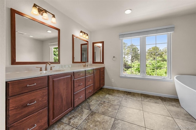 1564 S Uinta Way, Denver, CO 80231 - full bath with double vanity, a soaking tub, baseboards, recessed lighting, and tile patterned floors