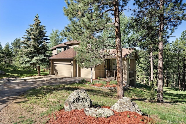 2873 Cortina Ln, Evergreen, CO 80439 - view of front facade featuring asphalt driveway and a garage