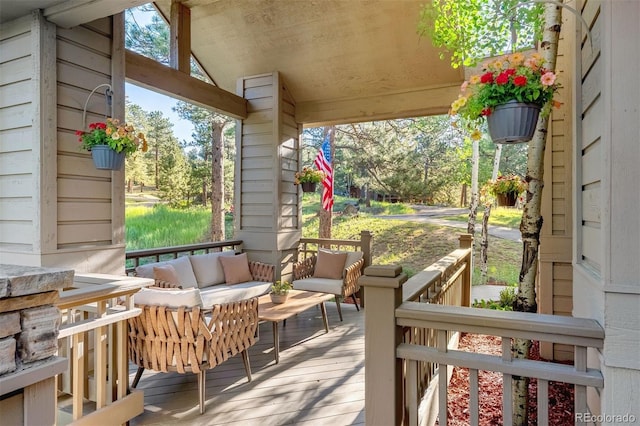 2873 Cortina Ln, Evergreen, CO 80439 - porch with an outdoor hangout area