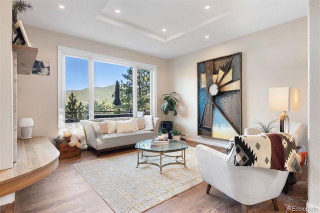2873 Cortina Ln, Evergreen, CO 80439 - living room with wood finished floors, recessed lighting, and a tray ceiling
