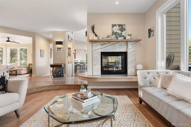 2873 Cortina Ln, Evergreen, CO 80439 - living area with a fireplace, a ceiling fan, wood finished floors, and recessed lighting