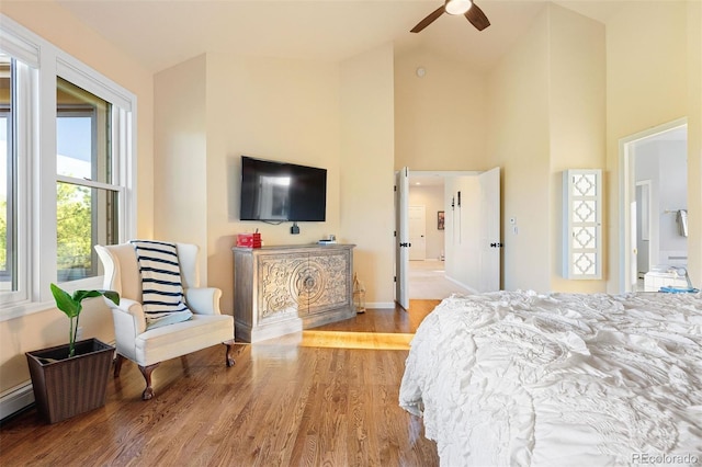 2873 Cortina Ln, Evergreen, CO 80439 - bedroom featuring wood finished floors, high vaulted ceiling, and a ceiling fan