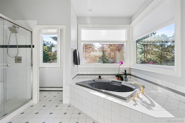 2873 Cortina Ln, Evergreen, CO 80439 - bathroom with baseboard heating, a whirlpool tub, and plenty of natural light