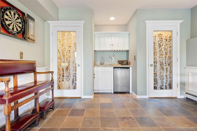 2873 Cortina Ln, Evergreen, CO 80439 - indoor bar featuring dishwasher, recessed lighting, dark stone finish flooring, and a baseboard heating unit