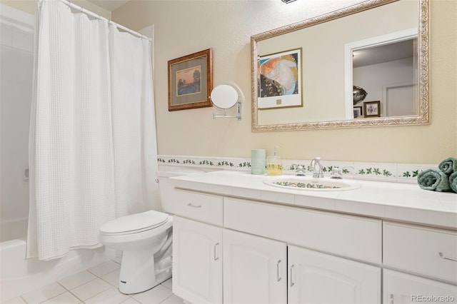 2873 Cortina Ln, Evergreen, CO 80439 - bathroom with vanity, tile patterned floors, and shower / bath combo with shower curtain
