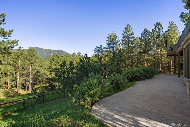 2873 Cortina Ln, Evergreen, CO 80439 - view of yard featuring a mountain view and a forest view