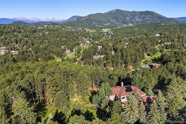2873 Cortina Ln, Evergreen, CO 80439 - aerial overview of property's location with a heavily wooded area and mountains