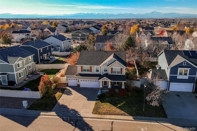 birds eye view of property featuring a mountain view