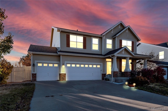 view of front of home with a garage and a porch