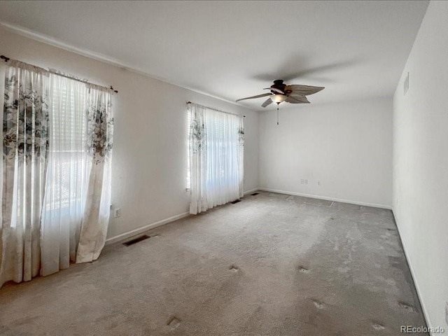 empty room with carpet and ceiling fan