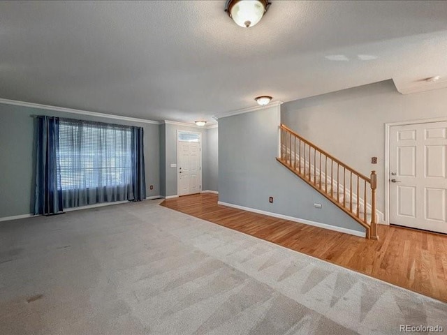 unfurnished living room with ornamental molding