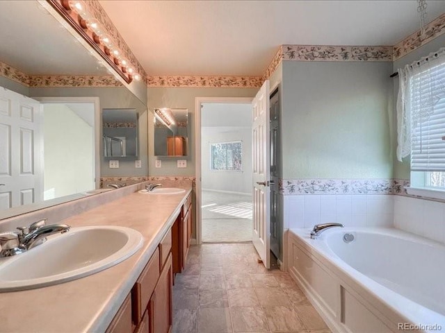 bathroom featuring vanity and a bathtub