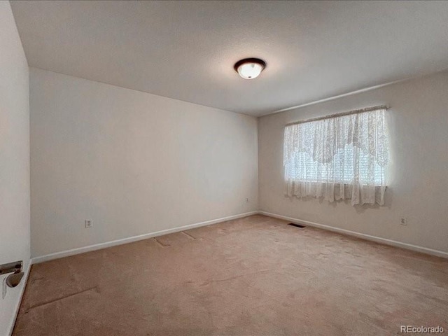 view of carpeted spare room