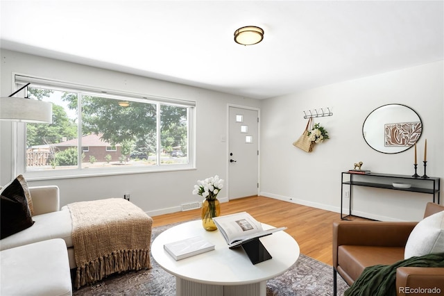 6015 Everett St, Arvada, CO 80004 - living room with light wood-style floors and baseboards