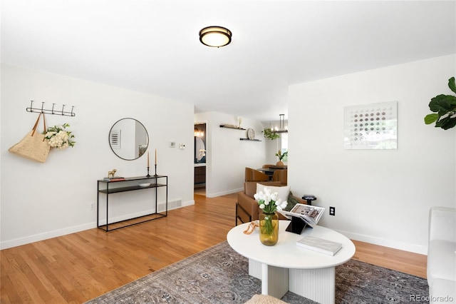 6015 Everett St, Arvada, CO 80004 - living area with wood finished floors and baseboards