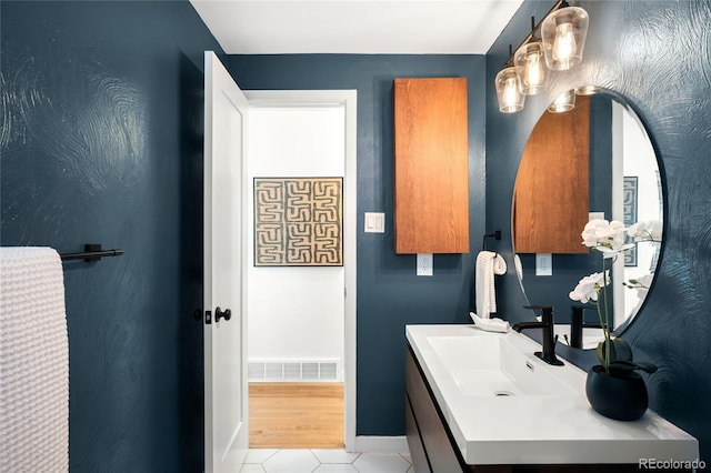6015 Everett St, Arvada, CO 80004 - bathroom featuring vanity and tile patterned flooring