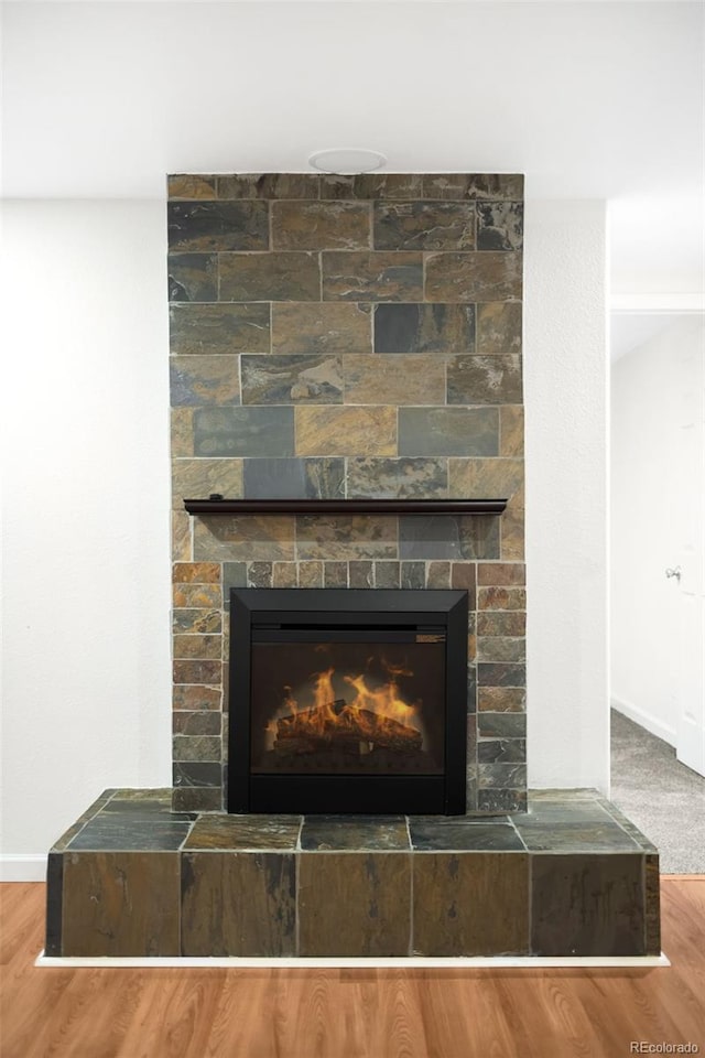 6015 Everett St, Arvada, CO 80004 - detailed view of a large fireplace and wood finished floors